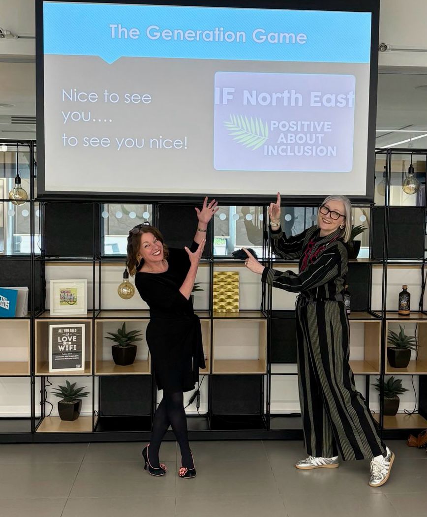 IFNE Northern Design Centre K&L Lucy and Karen are standing below a large screen displaying the opening slide of their presentation for the Inclusion Forum North East The Generation Game
